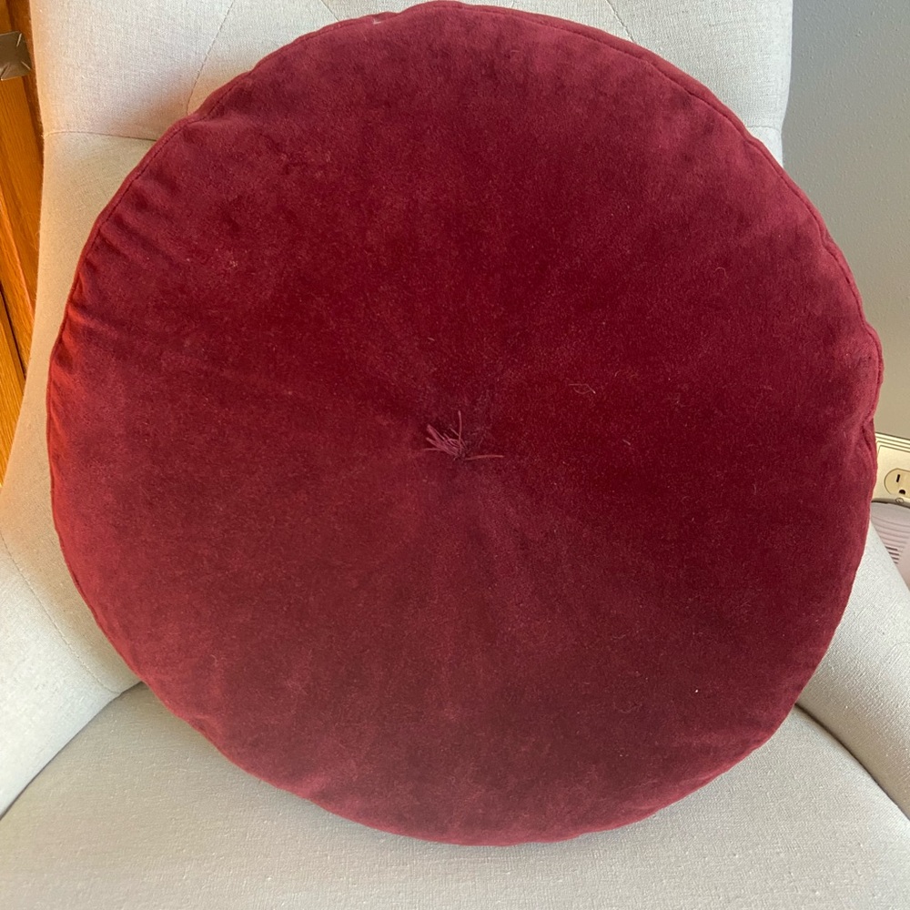 Pottery Barn round wine velour pillow.